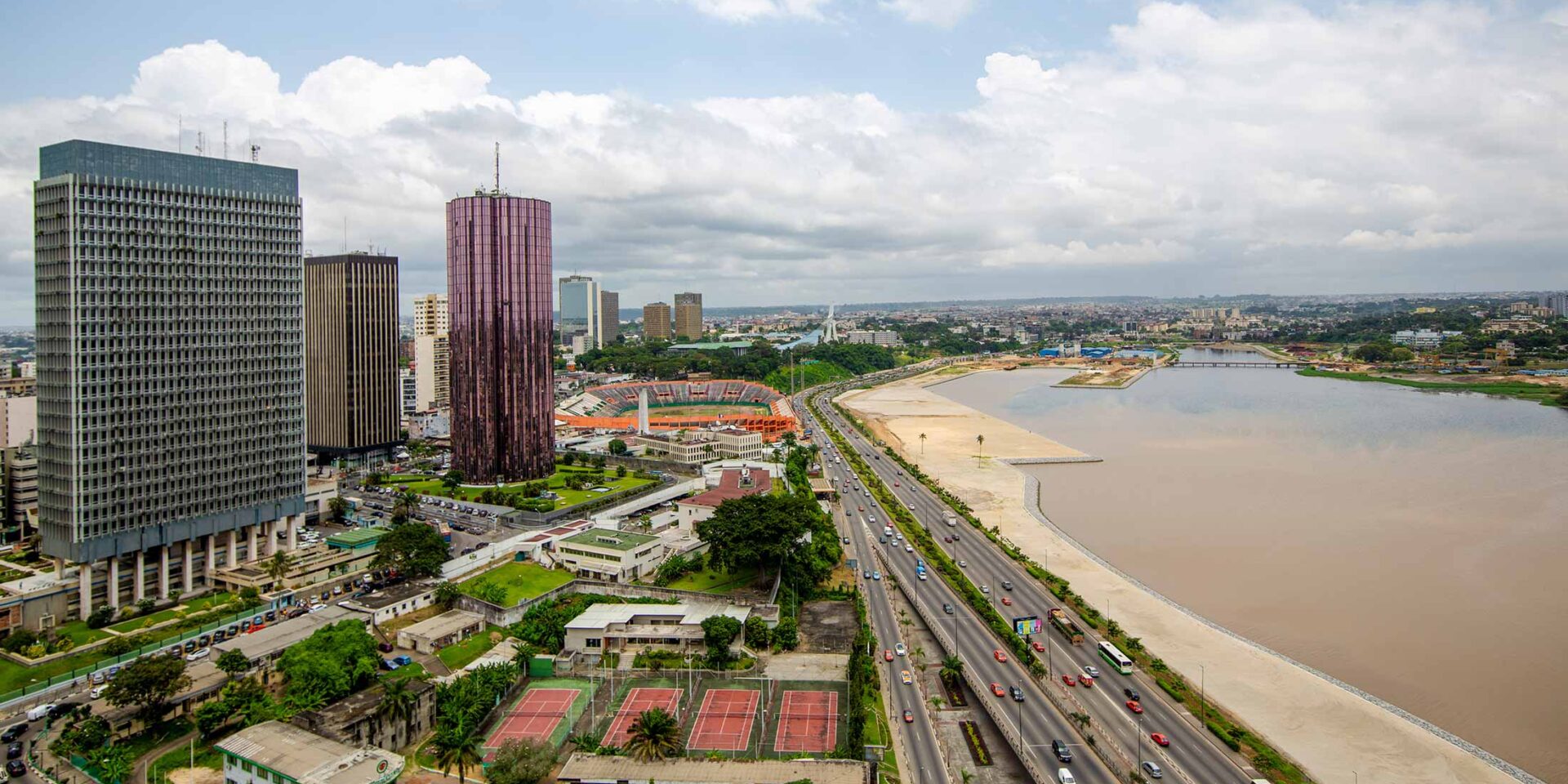 an aerial view of a city with a river in the middle