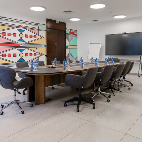 a conference room with a long table and chairs