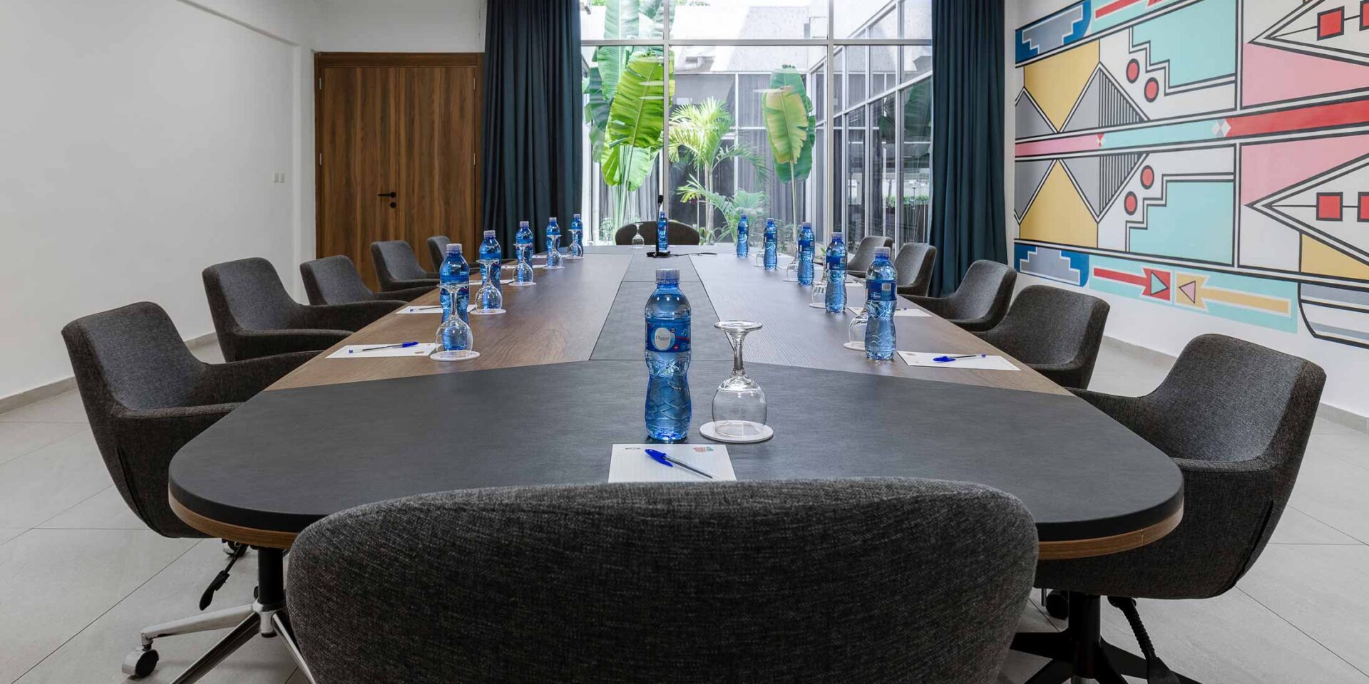 a conference room with a long table and chairs