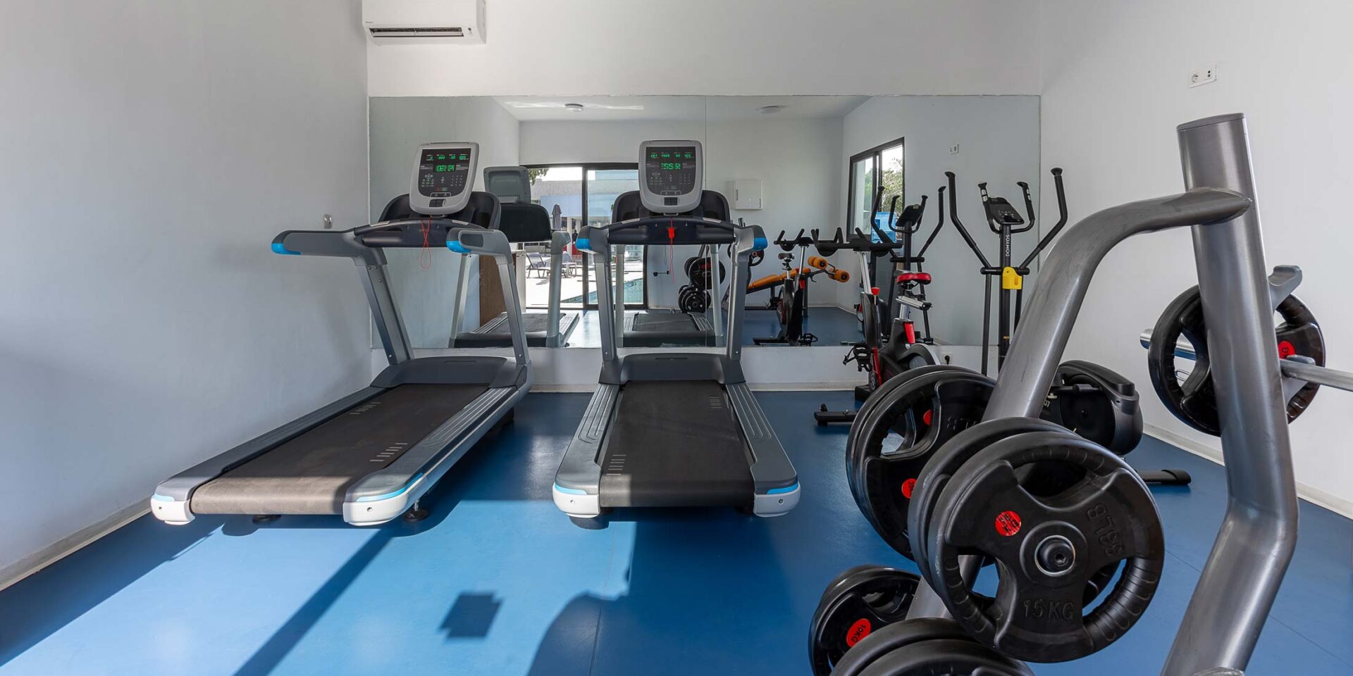 treadmills in a gym with one that says ' matrix ' on it