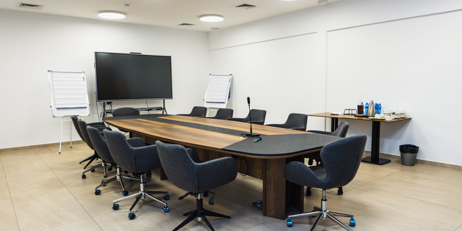 a conference room with a long table and chairs