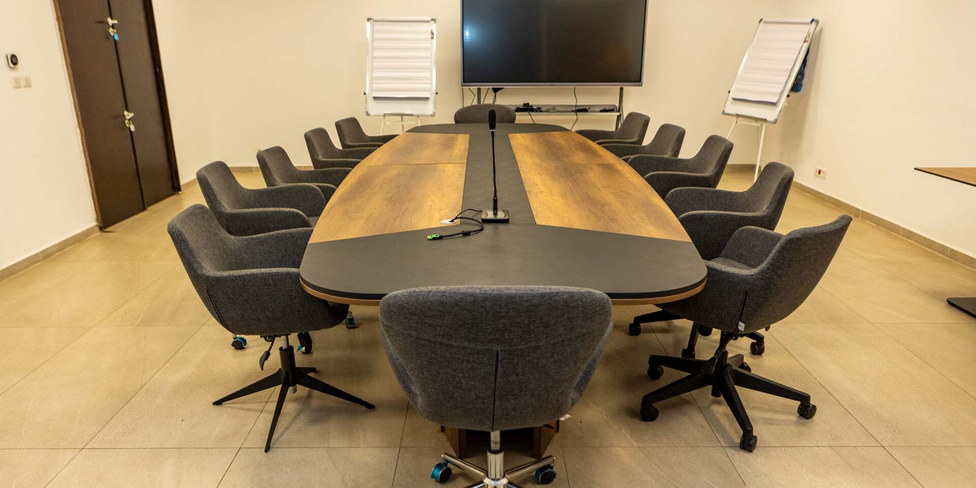 a conference room with a long table and chairs