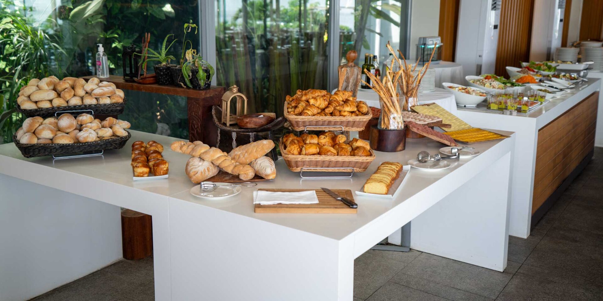 a buffet table filled with bread and other food items