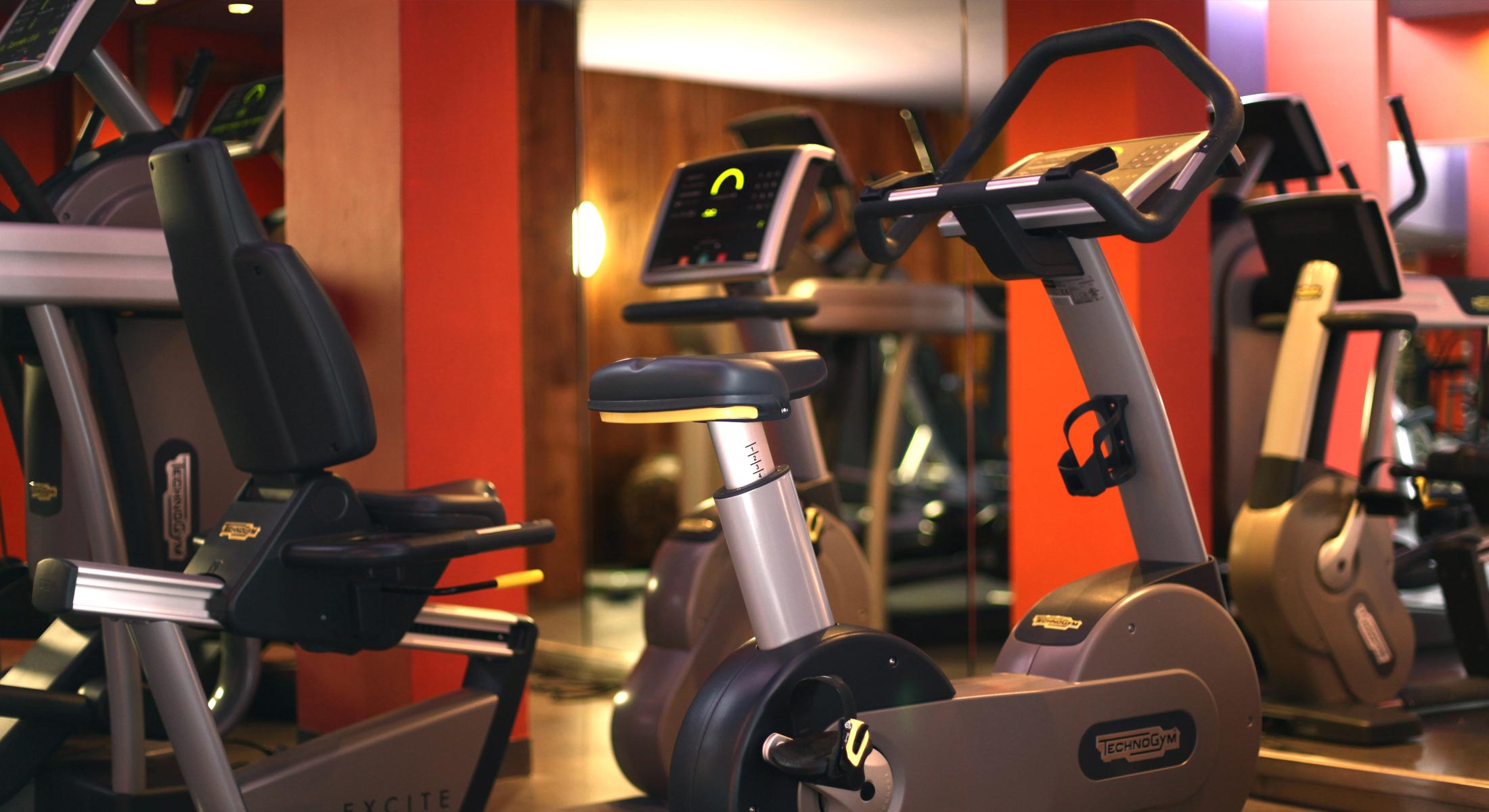 an excite exercise bike is sitting in a gym