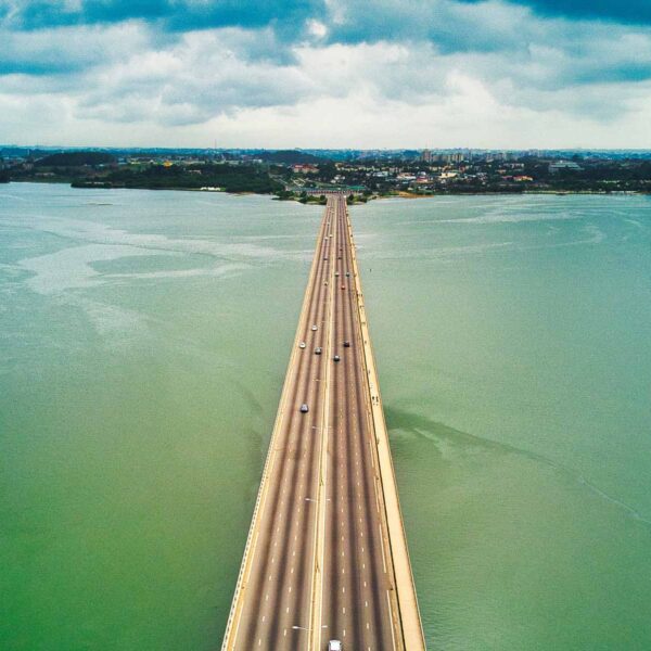 an aerial view of a bridge over a body of water